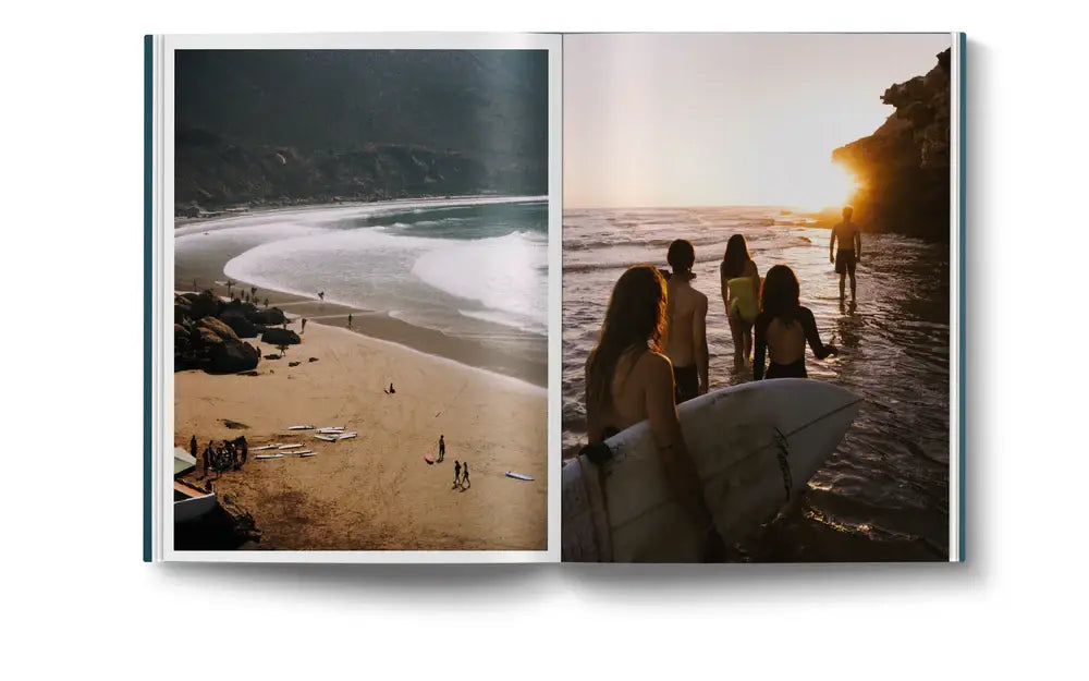 A spread from "The Coolest Ibiza" by Loft Publications features a sandy beach with waves and surfers on the left page, and four people with surfboards entering the ocean at sunset on the right page.