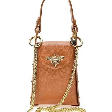 Brown leather handbag with gold chain and bee emblem on a white background