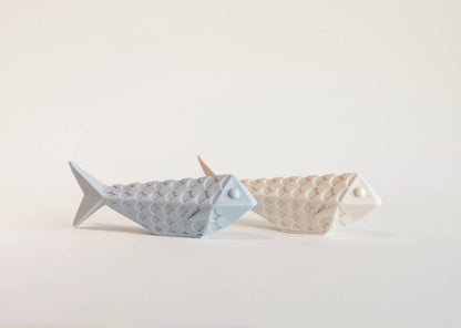 Close-up of blue and sardine showing wax texture and elegant design details