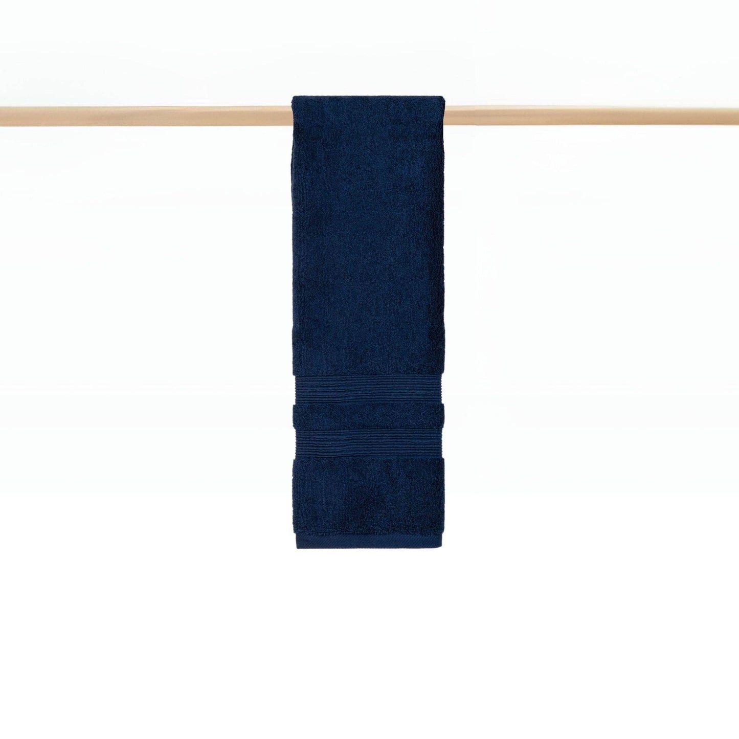 Cobalt blue towel hanging on rail in a modern bathroom