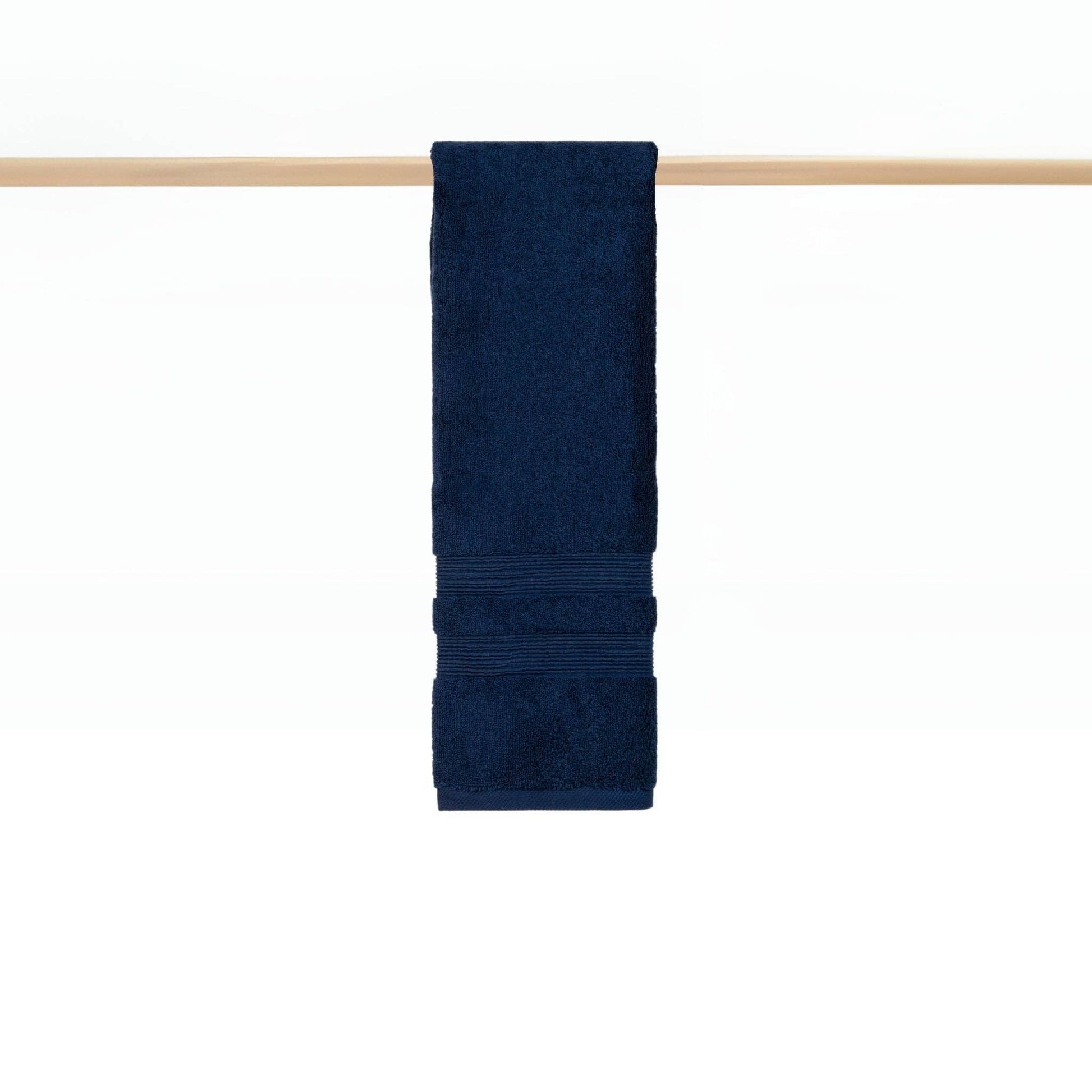 Cobalt blue towel hanging on rail in a modern bathroom