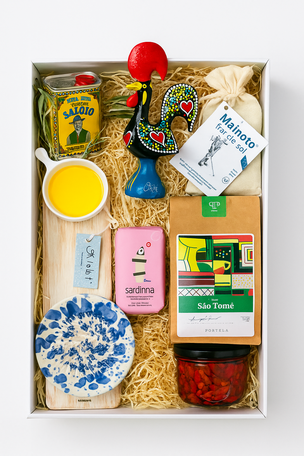 The Iberica Gourmet Hamper #1 by Iberica - Pretty things from Portugal includes olive oil, a ceramic rooster, sea salt, soap, sardines, coffee, a blue dish, wooden board, red peppers, and a pouch—artisanal Portuguese gifts in one beautiful set.