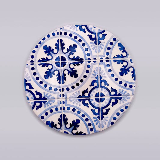 blue hand painted ceramic trivet