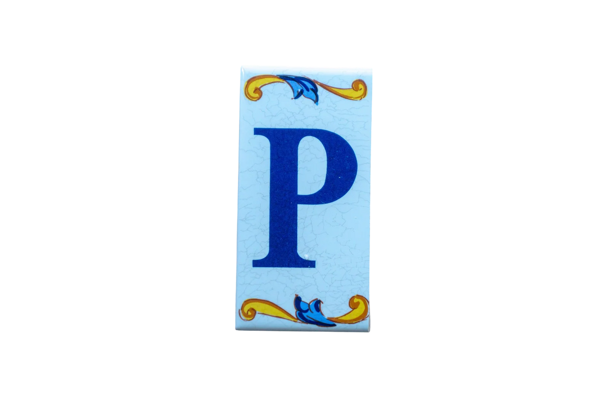 Lisa Croquets Letters – Ceramic House Letter Tile featuring a rectangular design with a blue letter P surrounded by blue and yellow scrollwork on a light blue background.