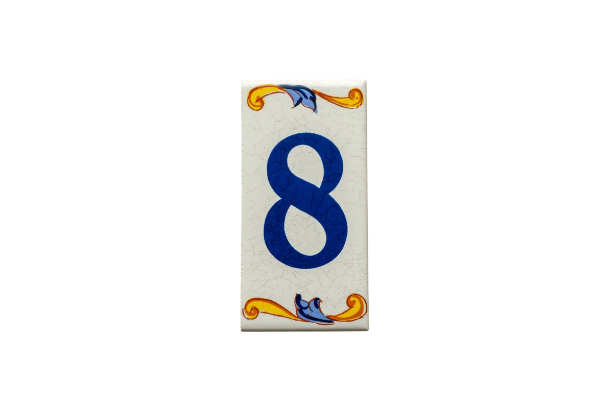 Rectangular Lisa Croquets Numbers ceramic house number tile featuring the number eight in blue, with handcrafted Spanish decorative blue and yellow scrollwork at the top and bottom.