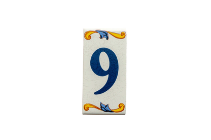 Lisa Croquets Numbers – Ceramic House Number Tile in a rectangular Mediterranean style, featuring the number nine in blue with yellow and blue floral scrollwork at the top and bottom.
