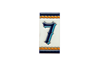 LVR Ceramics Marine Ceramic House Number & Letter Tile: a rectangular Mediterranean tile featuring the number seven in blue and teal with orange rope-style borders.