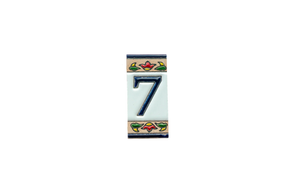 LVR Ceramics Mini Chilli Ceramic House Number & Letter Tile featuring the number seven in dark blue with colorful floral borders at the top and bottom in the style of handcrafted Spanish tiles.