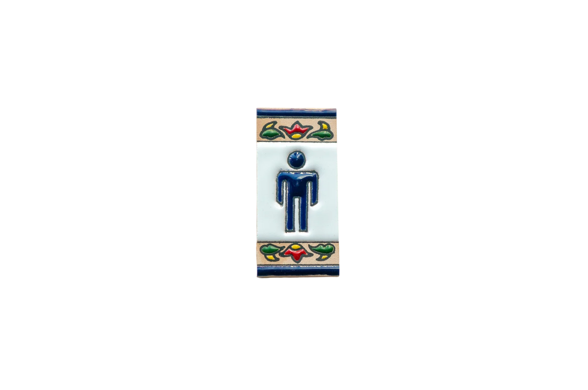 Mini Chilli Ceramic House Number & Letter Tile: a rectangular handcrafted Spanish tile featuring a blue male restroom icon with colorful floral borders at the top and bottom.