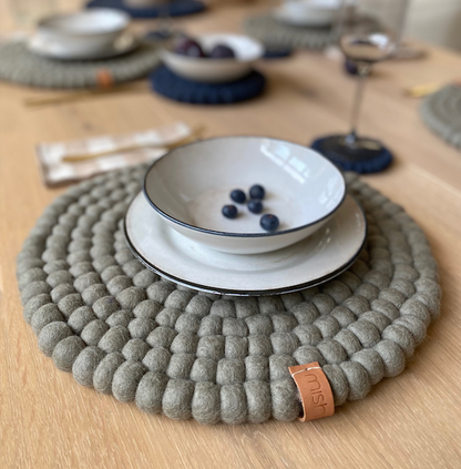 Pipa neutral grey felt placemat styled on a contemporary dining table