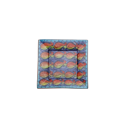 This square ceramic plate from Iberica - Pretty things from Portugal features rows of red, yellow, and green fish on blue with a scalloped border—an ideal addition to your Fishes serving set.