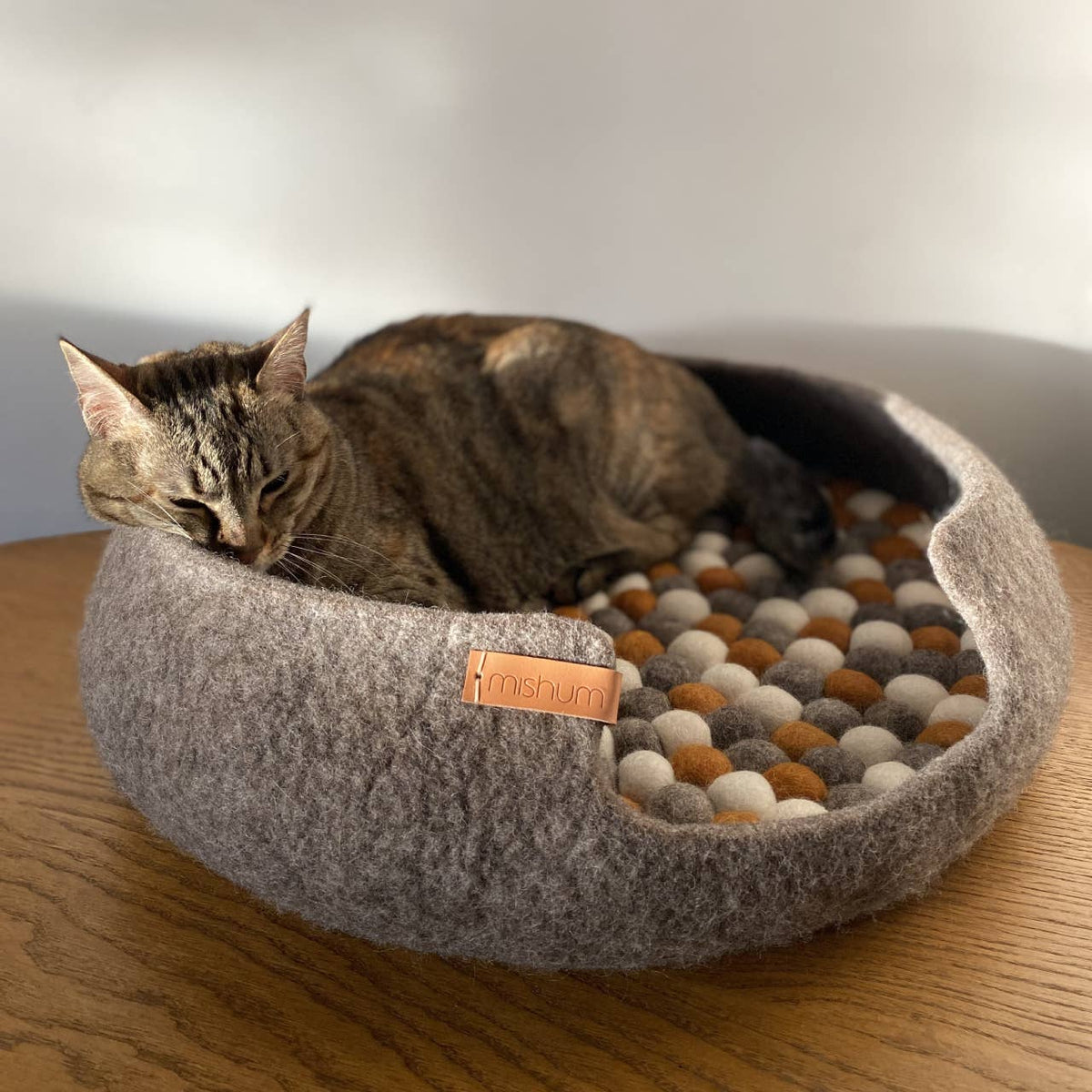 Simona handcrafted wool felt pet beds in Silver and Brown