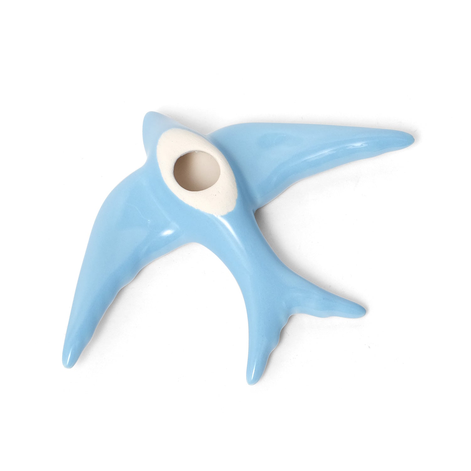Casa Atlantica’s Ceramic Swallows Individual item (Auritas) is a glossy, light blue ornament with a white center and outstretched wings, inspired by swallows—an ideal way to add Mediterranean charm to your wall decor.